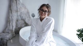 emily black playing with her toy in the bathtub